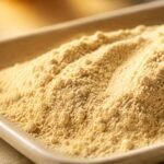 Close-up texture of light yellow to brown earthworm-derived lumbrokinase powder